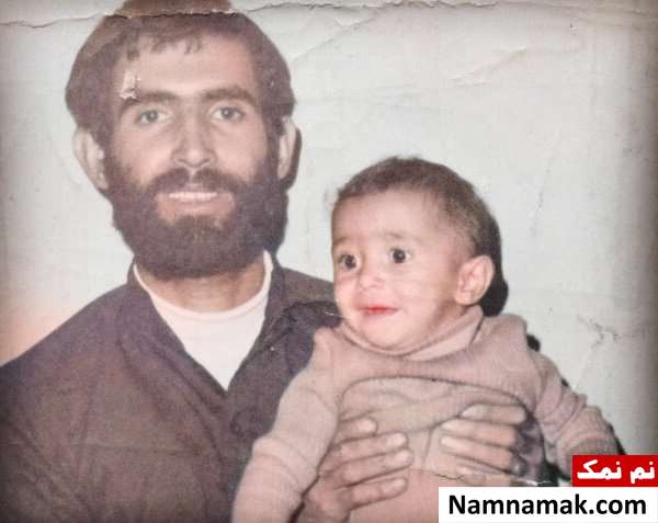کودکی هادی کاظمی در آغوش پدرش